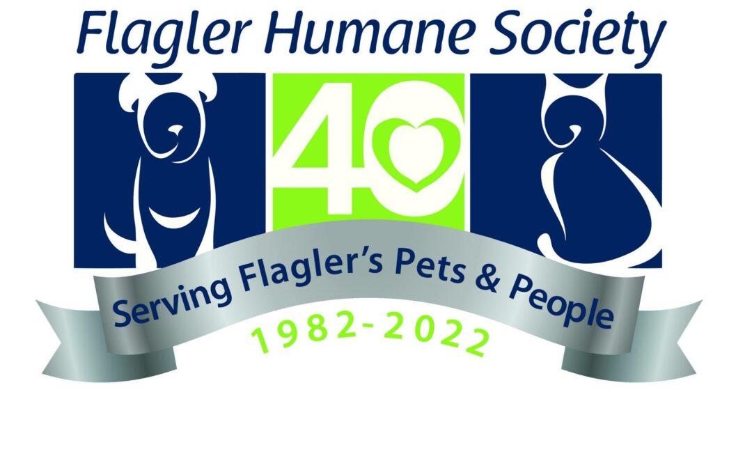 The Flagler Humane Society logo celebrating their 40th anniversary (1982-2022) features silhouettes of a dog and a cat, a green heart with the number 40, and a ribbon with the text "Serving Flagler's Pets & People." News from Palm Coast highlights this milestone for Flagler County’s beloved organization.