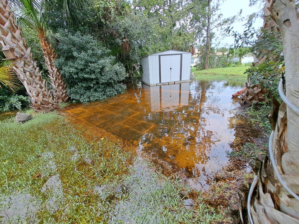 flooded back yard back yard of a palm coast home flooded after rain
