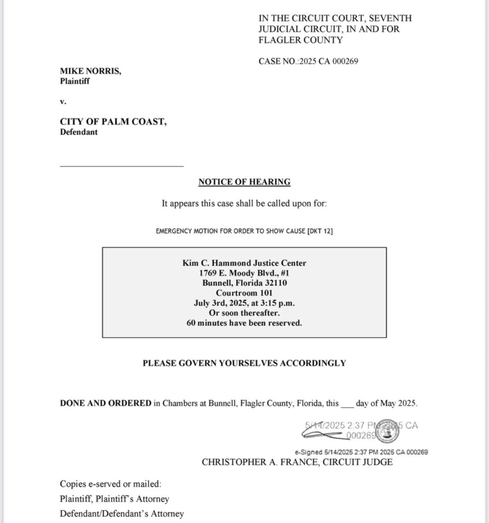 A court notice of hearing document addressed to Mike Norris vs City of Palm Coast, stating an emergency motion hearing scheduled for July , , at the Kim C Hammond Justice Center in Bunnell, Florida