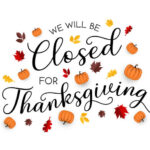 A sign reads “We will be closed for Thanksgiving,” decorated with autumn leaves and small pumpkins on a white background