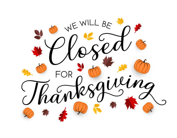 A sign reads “We will be closed for Thanksgiving,” decorated with autumn leaves and small pumpkins on a white background