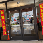 Glass doors of Animal Emergency Hospital Palm Coast, displaying contact info and hours Bright red and yellow "Grand Opening" banners hang on both sides, with people and reflections visible through the glass Glass doors of Animal Emergency Hospital Palm Coast, displaying contact info and hours Bright red and yellow "Grand Opening" banners hang on both sides, with people and reflections visible through the glass