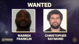 Two men, labeled Warren Franklin and Christopher Raymond, are shown in passport style photos on a “WANTED” notice with police and operation logos in the corners Two men, labeled Warren Franklin and Christopher Raymond, are shown in passport style photos on a “WANTED” notice with police and operation logos in the corners